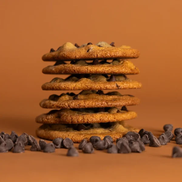 Soft and chewy Chocolate Chip Cookies stacked on a plate