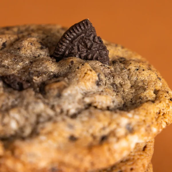 Freshly baked Cookies & Cream cookies with crushed Oreo pieces on top