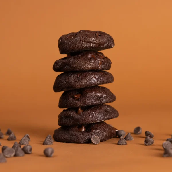 Gourmet Double Dark Chocolate Chip cookies stacked on a plate